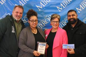 Federal Way Mirror Multi-Media Sales Manager Cindy Ducich stands with the Best Breakfast winner, Black Bear Diner. Alex Bruell / The Mirror