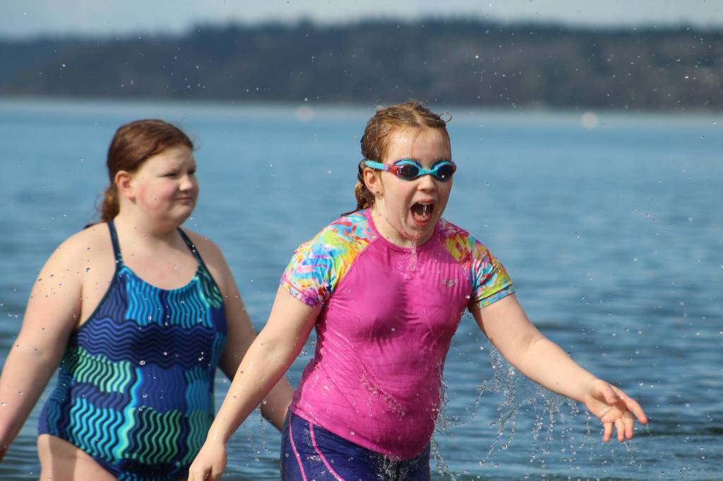 More than a dozen people plunged into the chilly waters of the Puget Sound on Saturday, March 10, for the Marine Hills Swim and Tennis Club Polar Bear Plunge. Alex Bruell / The Mirror