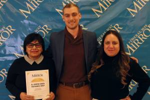 El Centro de la Raza Executive Director Estela Ortega, left, stands with Mirror reporter Alex Bruell and Liz Huizar, director of Youth Services at El Centro de la Raza. Olivia Sullivan / The Mirror