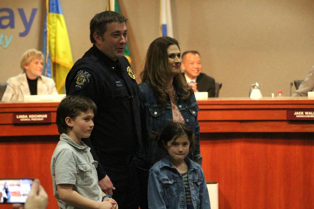 Commander Kyle Buchanan stands with his family at the Federal Way City Council Chambers March 21 during his promotional ceremony. Alex Bruell / The Mirror