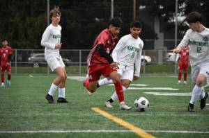 Joel Quinones takes the ball inside the 18 yard box against Kentwood. Ben Ray / The Mirror