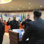 Alex Bruell / The Mirror
Mayor Jim Ferrell administers the oath of office to new Federal Way PD officers (from left to right) David Pollock, Adnan Ihsan and David Agapov during the April 18 City Council meeting.