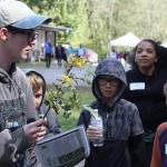 Green Gables elementary school kids learn about a species of flower during their trip to the the West Hylebos Wetlands during an April 27 field trip. Alex Bruell / The Mirror