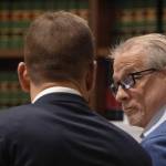 Patrick Nicholas, 59, (right) confers with his defense attorney David Montes after opening statements are made Monday, April 17, 2023, at the Maleng Regional Justice Center in Kent. Nicholas is standing trial for the December 1991 killing of 16-year-old Sarah Yarborough. Ellen M. Banner/The Seattle Times