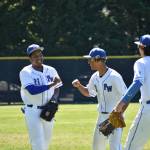 Federal Way outfielders all have a smile after Nate Peterson (21) made a nice grab to end the inning. Ben Ray / The Mirror