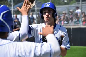 Jay ONeill gets a lot of high fives as he scores the second run of the game for the Eagles. Ben Ray / The Mirror