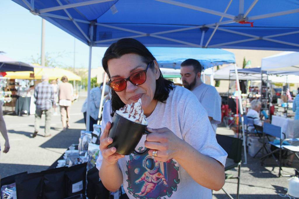 Anna Everson shows one of her mocha-themed candles. Alex Bruell / The Mirror