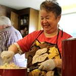 Mercedes Porras prepares a rice and veggies dish and shows off more homemade treats in these photos taken May 6 at the Church of the Good Shepherd. We love Mercedes, the volunteers agreed. Alex Bruell / The Mirror