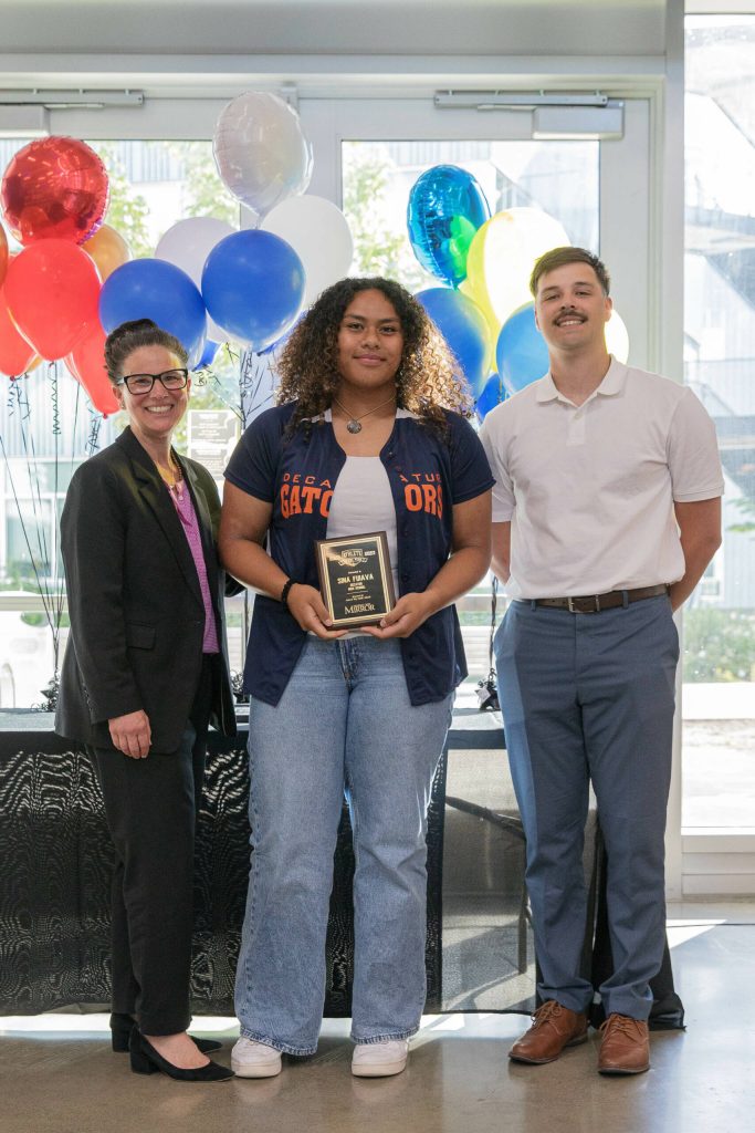 Decatur junior Sina Fuiava receives award and picture with Dr. Dani Pfeiffer and Mirror sports reporter Ben Ray. (Photo Provided by FWPS)