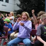 Kids celebrate during the ladder-truck egg drop after one of the eggs, incredibly, rolls to safely after its package collides harshly with the ground. Alex Bruell / The Mirror