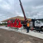 The iconic Dicks sign arrives on site in June 2023. Photo courtesy of Dicks Drive-in