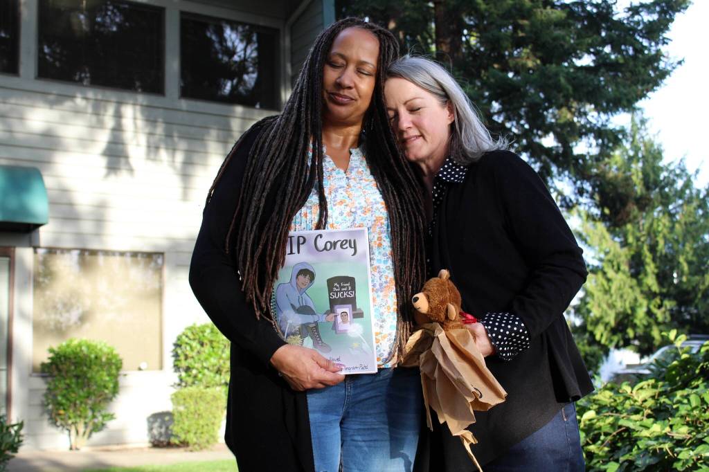 Alex Bruell / The Mirror 
Deena Rose, left, and Chris Buchanan stand outside Buchanans office in Federal Way. Buchanan has written a book for youth exploring their grief.