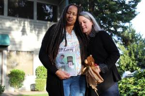 Alex Bruell / The Mirror 
Deena Rose, left, and Chris Buchanan stand outside Buchanans office in Federal Way. Buchanan has written a book for youth exploring their grief.