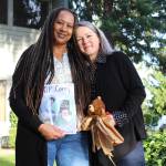 Deena Rose, left, and Chris Buchanan stand outside Buchanans office in Federal Way. Buchanan has written a book for youth exploring their grief. Alex Bruell / The Mirror