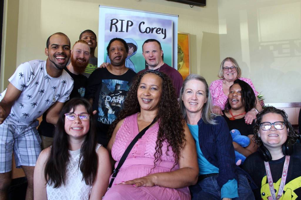 Photo by Alex Bruell / The Mirror. 
Corey Nettles friends and family gathered July 9 to celebrate the release of RIP Corey, a book for grieving young adults based on the life of the beloved Federal Way resident. Top row, left to right: Wille Blockson, Loren Kodimer, Anias Blockson, Marcel Foster, Kyle Jorgenson and Tammy Snow. Bottom row: Ariana Turchiano, Deena Rose, Chris Buchanan, Iesha Jackson and Samantha Fine.