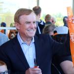 King County Councilmember Pete von Reichbauer holds a piece of the tape during the ribbon cutting for the new Federal Way Dicks Drive-In. This is a family operation committed to the local community, von Reichbauer said. (Alex Bruell / The Mirror)