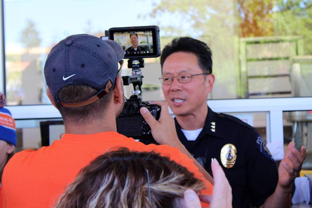 Federal Way Police Chief Andy Hwang was among the public officials interviewed July 27 at the opening of Dicks Drive-In in Federal Way. (Alex Bruell / The Mirror)