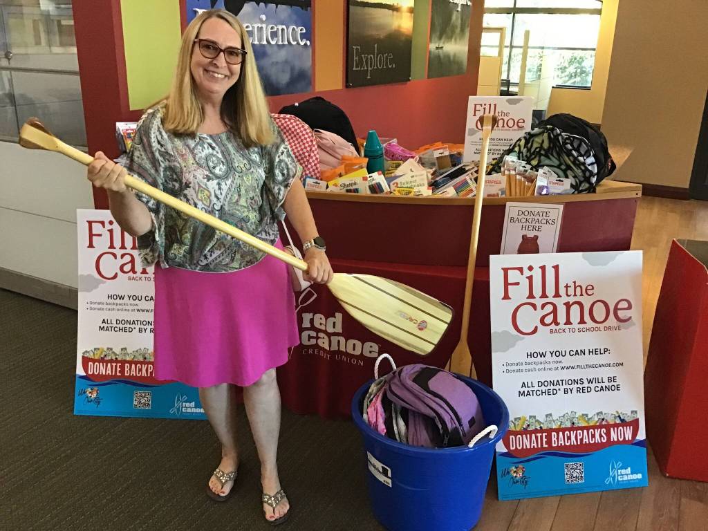 Donation contributor Vickie Chynoweth of Keller Williams dropping off 20 high quality backpacks. Photo provided by Red Canoe