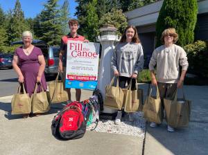 Photo by Shelley Pauls / We Love Our City
Volunteers for the Red Canoe school supply drive.