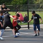 Olympic View students playing on their new mini soccer pitch. (Ben Ray/The Mirror)