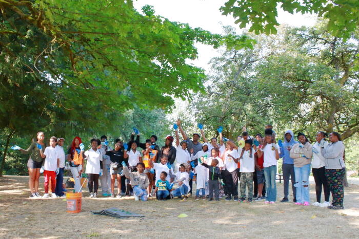 AYDEPI members get ready to start their volunteer event at Lake Geneva Park on Saturday. Photo by Keelin Everly-Lang / The Mirror