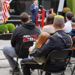 Lieutenant Jeff Mundell and his daughter watch Colonel Michael F. Keenan speak at the memorial event. Photo by Keelin Everly-Lang / The Mirror
