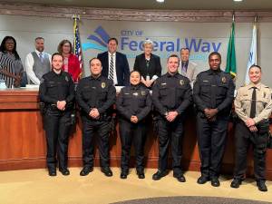 New Federal Way police officers pose with the City Council after being sworn in. Photo provided by the city of Federal Way.