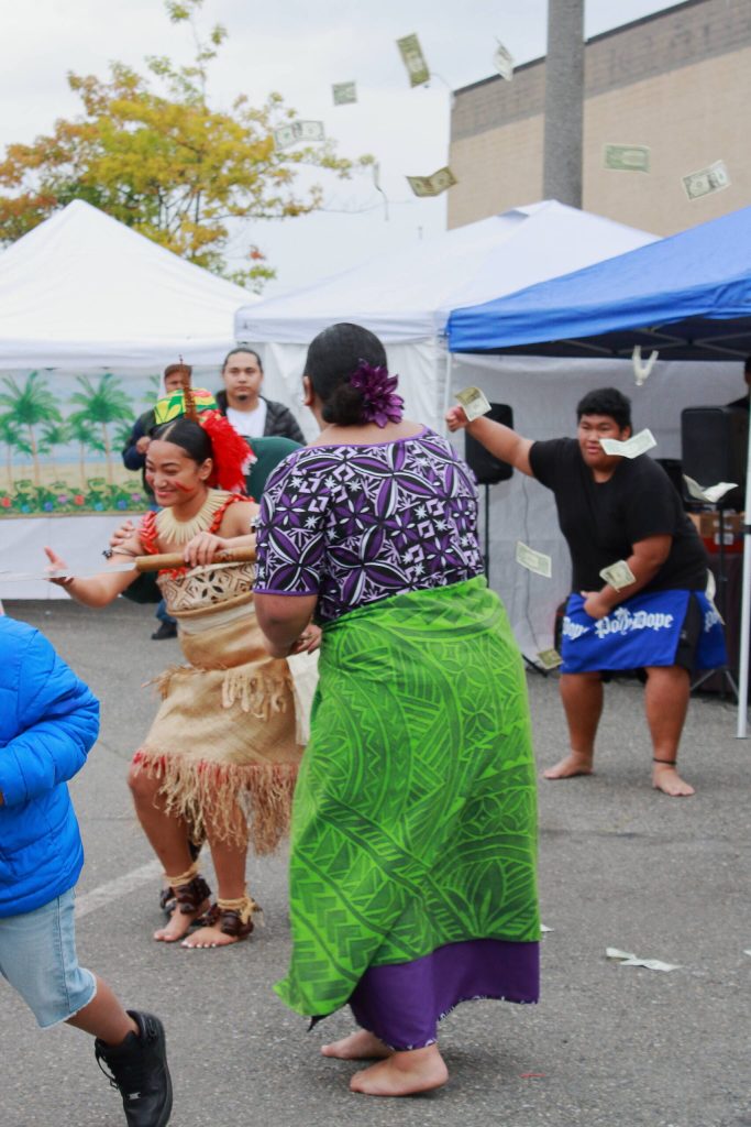 The practice of lafo brought money raining down during the Taualuga dance as the finale of the Federal Way High School Pacific Islander Clubs performance. Photo by Keelin Everly-Lang/ The Mirror