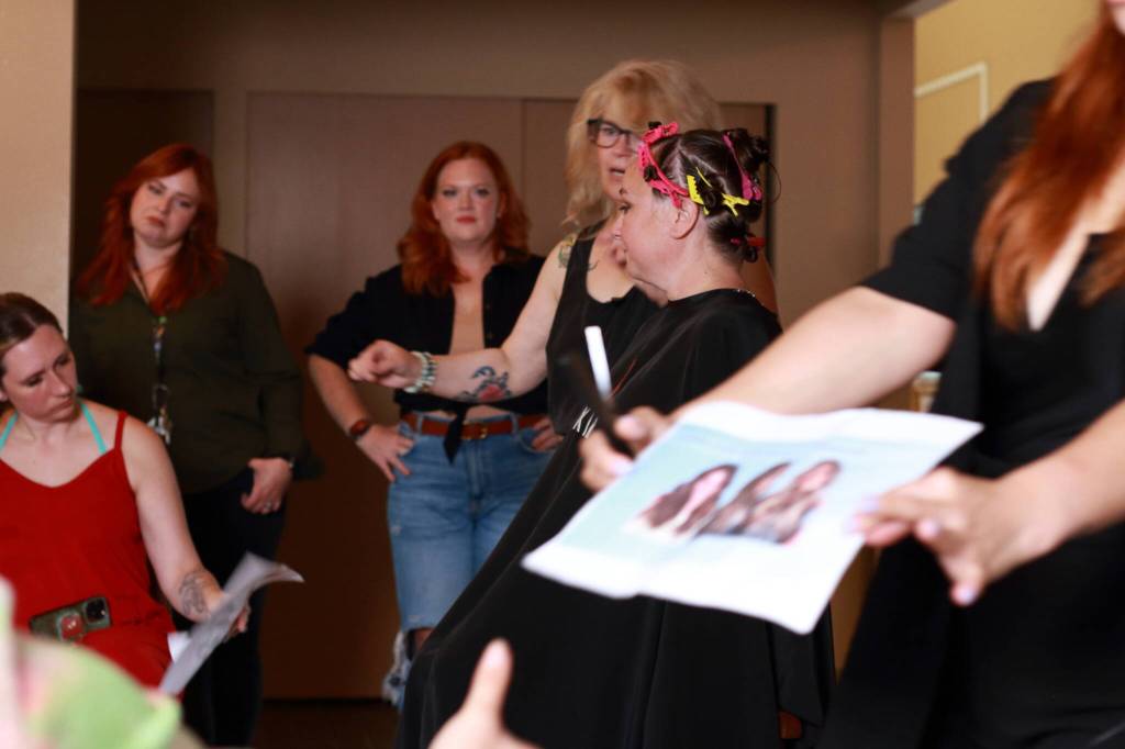 At a hair demonstration at a recent team energizer event, Bella Red employees learn new techniques. Photo by Keelin Everly-Lang /The Mirror