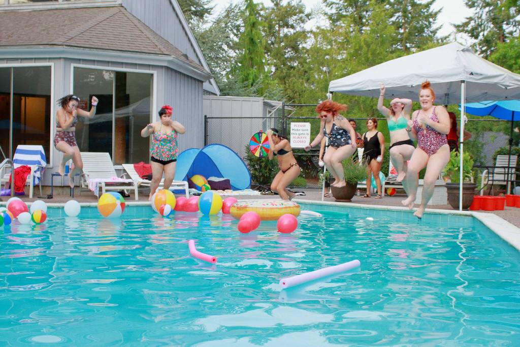 Photo by Keelin Everly-Lang / The Mirror
Kristin Speakman joins the fun with her team at a pool party team Energizer event for Bella Red employees.