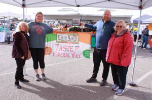 Photo by Keelin Everly-Lang / The Mirror
Ted Colby and Shannon Colby accept the prize for best decorated booth at the Taste of Federal Way for the Saint Vincent De Paul Parish School. Their restaurant partner was Puerto Vallarta Mexican in Twin Lakes.