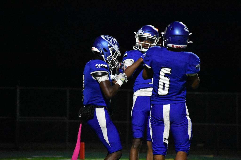 Zamaire Tellez (left), Jayden Sinclair (middle) and Deon Vann (right) dance after a touchdown. Ben Ray / The Mirror