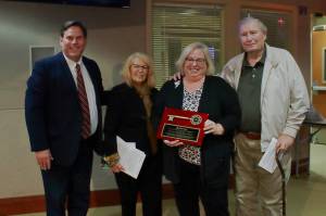 Rose Ehl, Dave Ehl and Karla Kolibab, founders of the Federal Way Farmers Market, accepted a Key to the City from Mayor Jim Ferrell. Photo by Keelin Everly-Lang / The Mirror