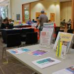 Libraries often have permanent tables of resources even when a fair isnt in session, like these materials at a table in front of the resource fair. The fair is held in the main area of the library near banks of computers making it accessible and easy to find. (Photo by Keelin Everly-Lang / The Mirror)