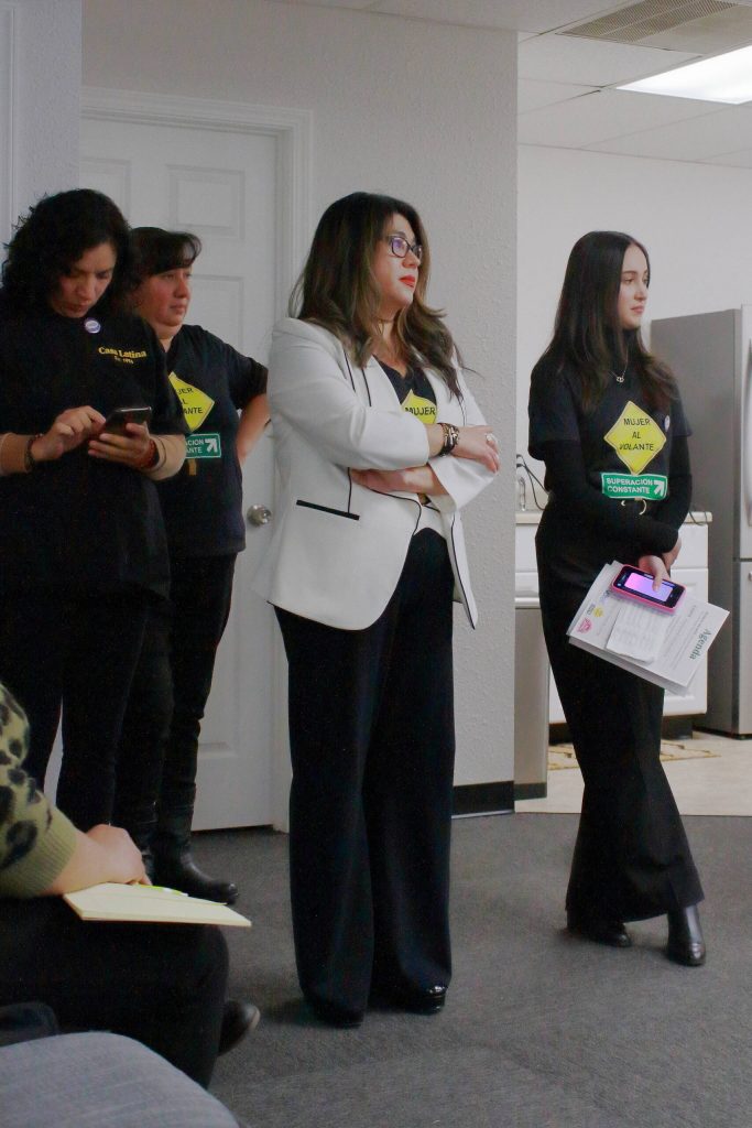 Jacqueline Garcia Castillo stands with members of her team and a leader at Casa Latina as she watches the City Council Candidates respond to voters on Wednesday. Photo by Keelin Everly-Lang / The Mirror.