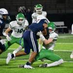 Junior Nehemiah Washington trucks a Falcon defender. Ben Ray / The Mirror