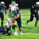 Decaturs Ben Ferrell takes down the Woodinville running back. Ben Ray / The Mirror