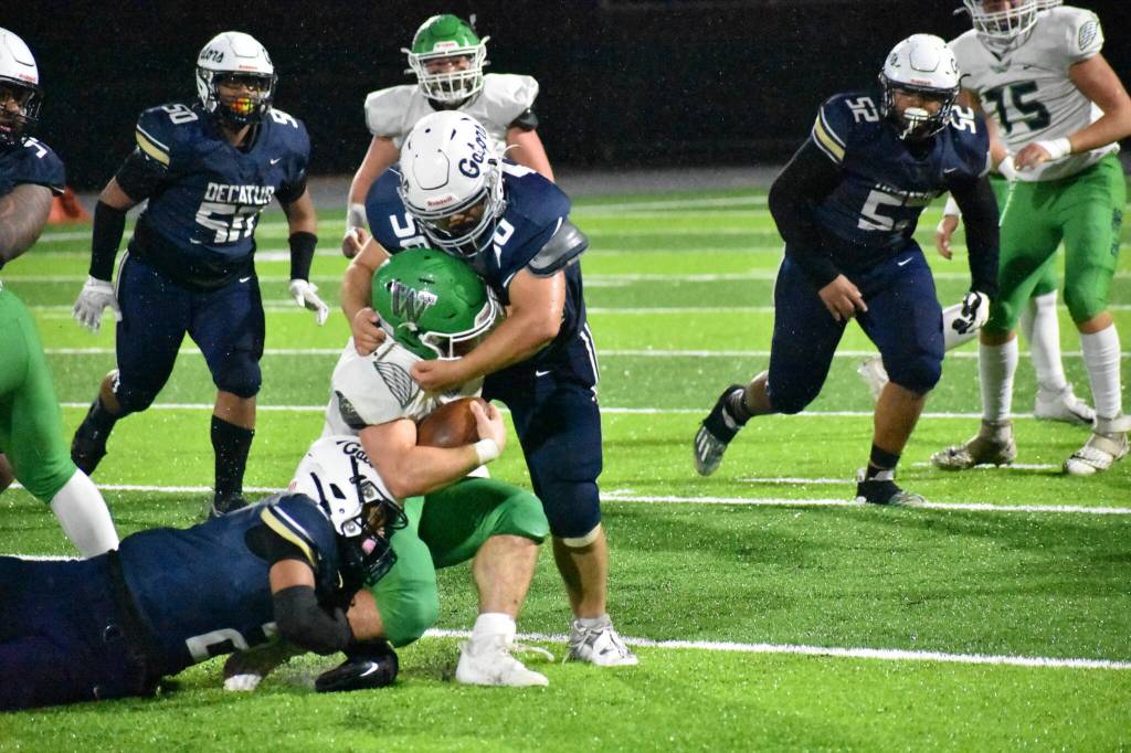 Decaturs Ben Ferrell takes down the Woodinville running back. Ben Ray / The Mirror