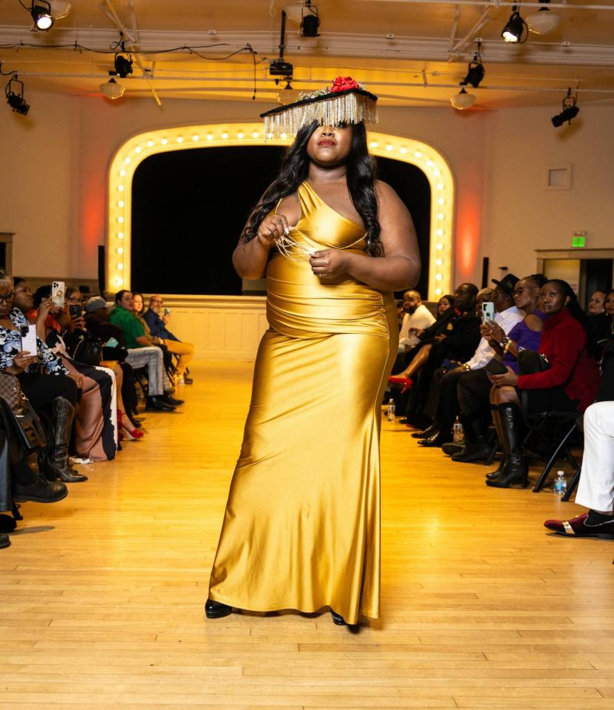 Photo by: Victor Jones (@genericvik)
Model Jenei Mayberry (@jenei_themodel_) on the runway wearing Audacious by Vaughnnie by designer DeVaughnn Williams.