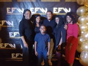 Multiple generations of the Williams family from Federal Way at Ebony Fashion Week, including founder and CEO DeVaughnn Williams. Pictured left to right: Darryl Williams Sr, DeArra Williams, Mycah Hopkins (front), Darryl Williams Jr, Carolyn Lockett and DeVaughnn Williams. Photo by: Victor Jones (@genericvick)