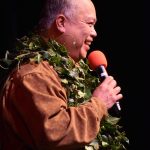 Kamaile Hamada speaks at the Aloha Kalikimaka 2023 opening ceremony. Photo by community member and photographer @t.g.koz on Instagram