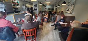 Carlecia Bell and Icea Pettigrew of Phenomenal She present about their organizations work at the Hot off the Presses community open house on Nov. 21 at Poverty Bay Cafe. The next Hot off the Presses event runs 1-2:30 p.m. Dec. 19 at the cafe, 1108 South 322nd Place, Federal Way. (Photo by Keelin Everly-Lang/The Mirror)