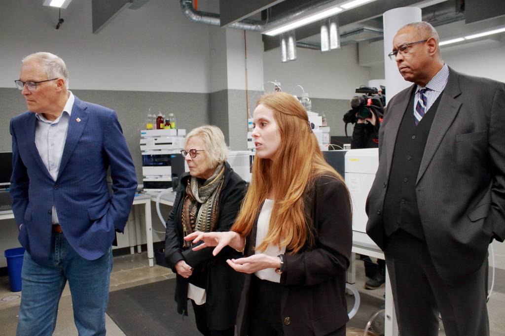 Technical Lead Madison Fuller shows the toxicology labs new equipement to Governor Inslee, Sen. Claire Wilson and John Batiste. Fuller will take on a new role as Quality Assurance Manager in January. Photo by Keelin Everly-Lang / The Mirror