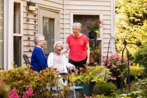 Senior living communities can help alleviate feelings of isolation and loneliness by providing a warm, welcoming environment. Village Green photo