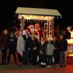 This group of neighbors gathered hundreds of pounds of food donations to hand over during the Santa Parade.