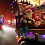 Kids could sit with Santa for photos at the spontaneous stops along the Santa Parade route on Dec. 12. (Photos by Keelin Everly-Lang / The Mirror)