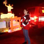 Annisa Lee is a firefighter and EMT at West Pierce but helped out her dad at the South King Fires Santa Parade.