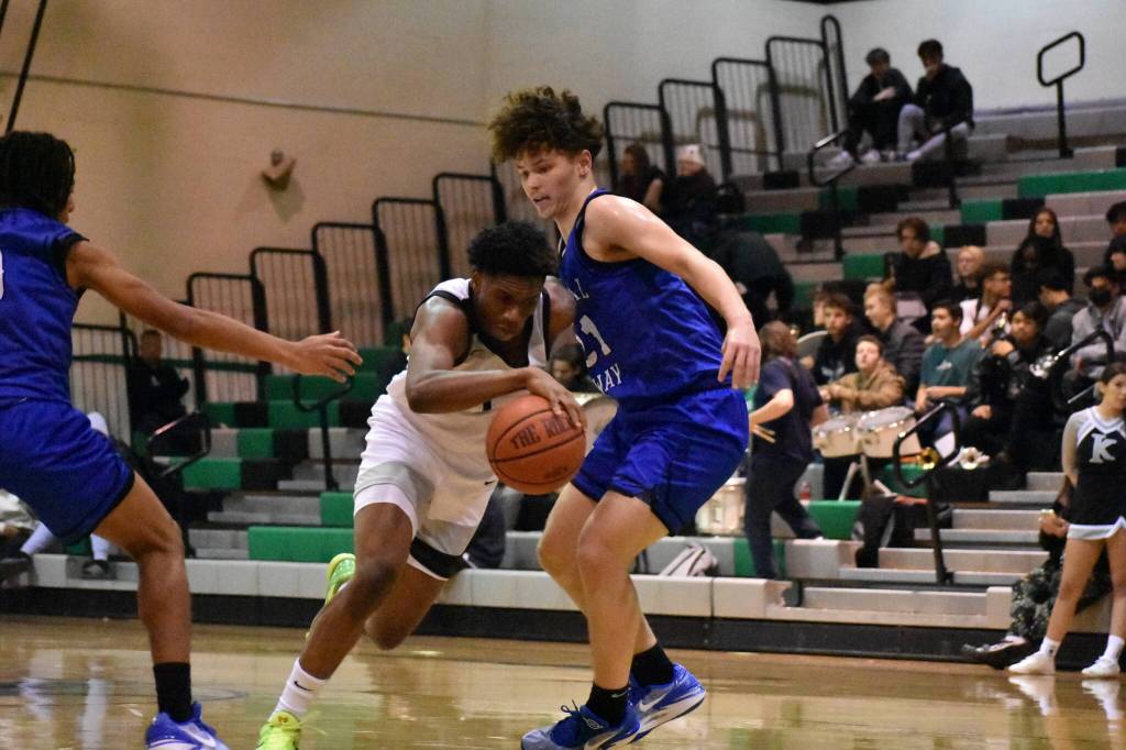 Brayden McVey plays defense against Kentwood. (Ben Ray / The Mirror)
