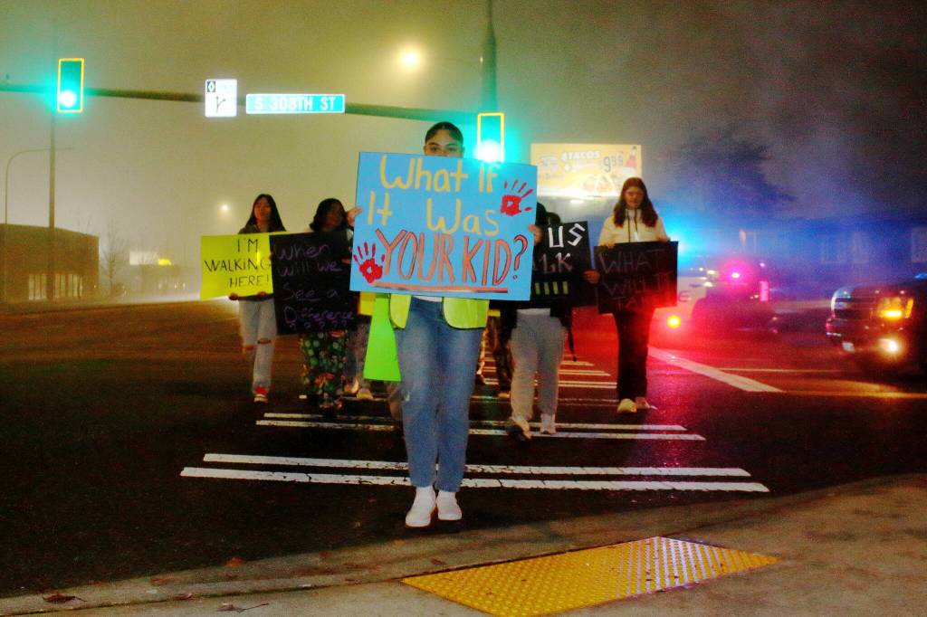 Student protesters crossed in the intersection between 308th Street and Pacific Highway where a student was recently hurt. (Photo by Keelin Everly-Lang / FW Mirror)