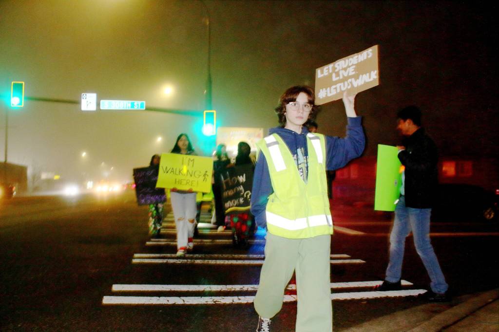 Students donned safety vests as they protested in the intersection in front of Federal Way High School that has been the site of multiple pedestrian incidents. (Photo by Keelin Everly-Lang / FW Mirror)